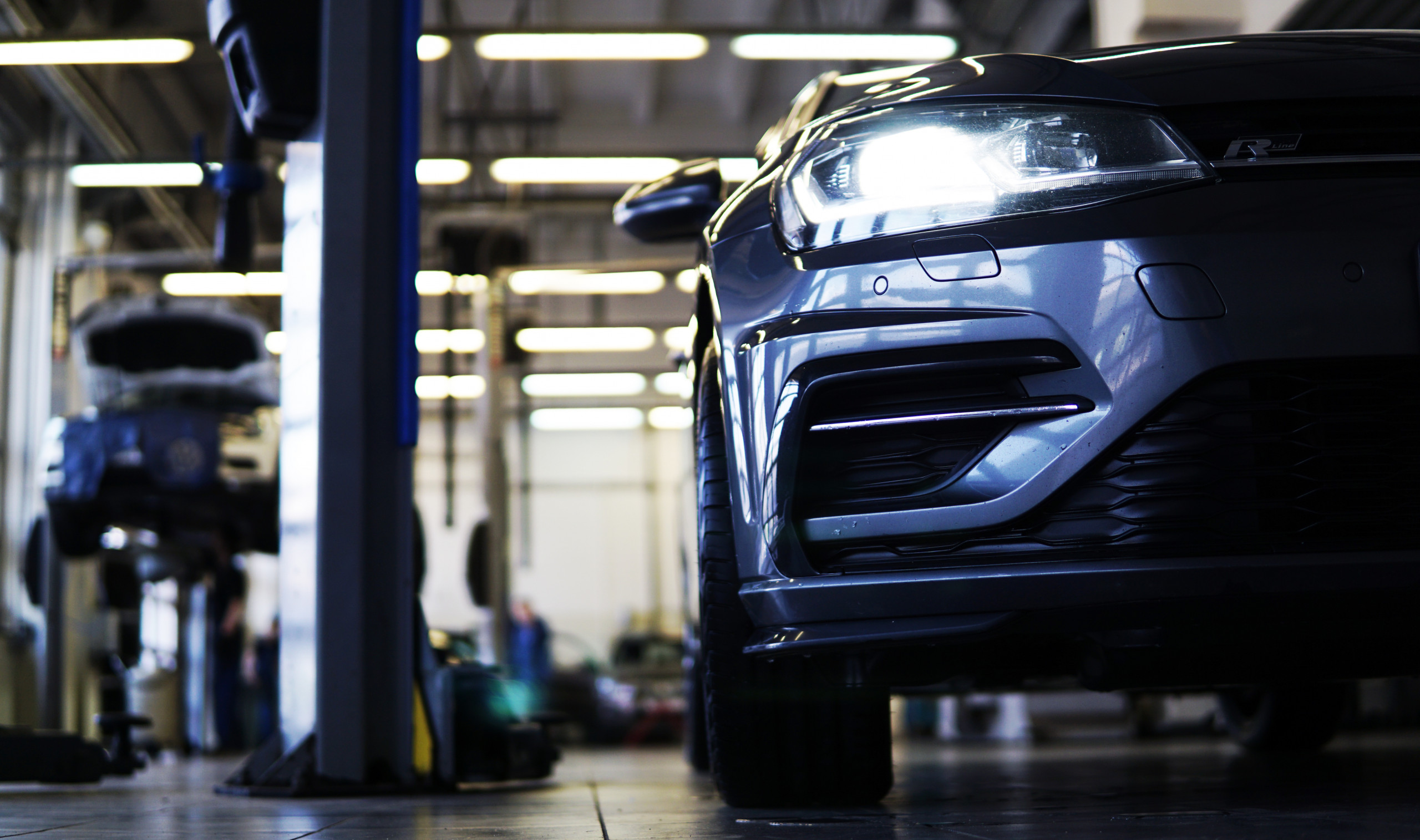 Moscow Russia – May 16 2021: Modern car in a car service. Close up of the front of the car, the background is blurred. Selected focus. Car service, body repair, spare parts.